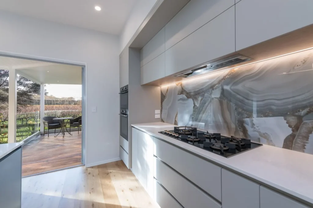 New kitchen with marble look splashback in the Takaka Hill renovation