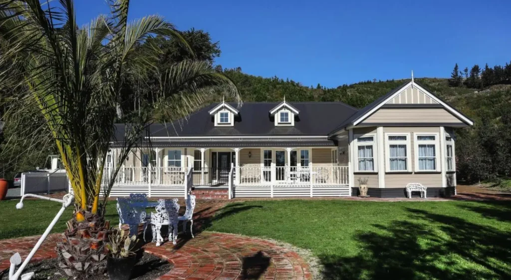 Colonial style home at Wakapuaka with dormer windows and white veranda